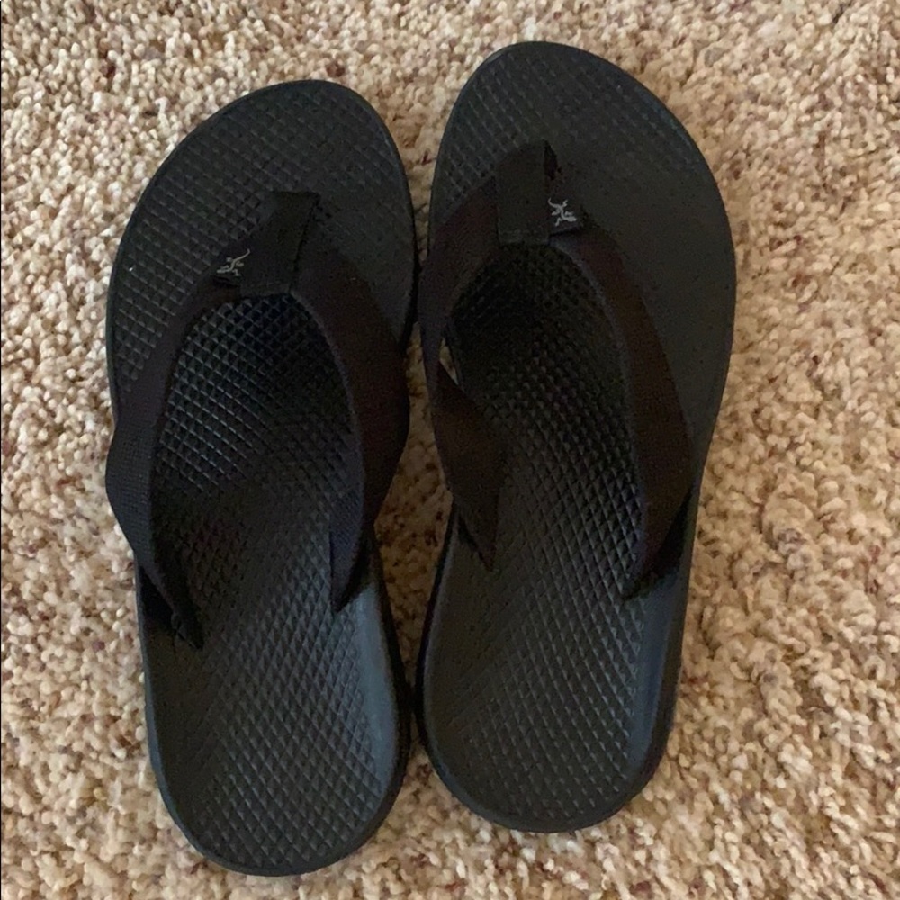 Black Chaco flip flops